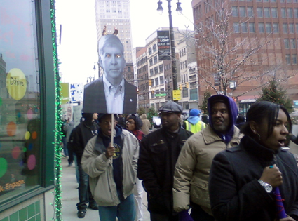 Protesters march outside the D:hive in Detroit. (credit: WWJ/Stephanie Davis)