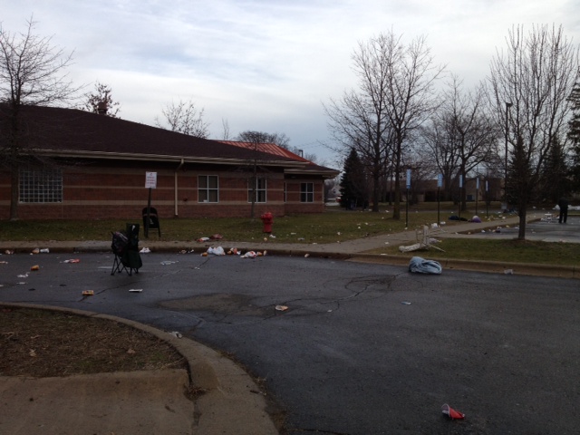 Garbage litters the ground at a human services building in Taylor where thousands of people rioted when a Section 8 Housing Choice Voucher distribution event was cancelled. (WWJ Photo/Beth Fisher)