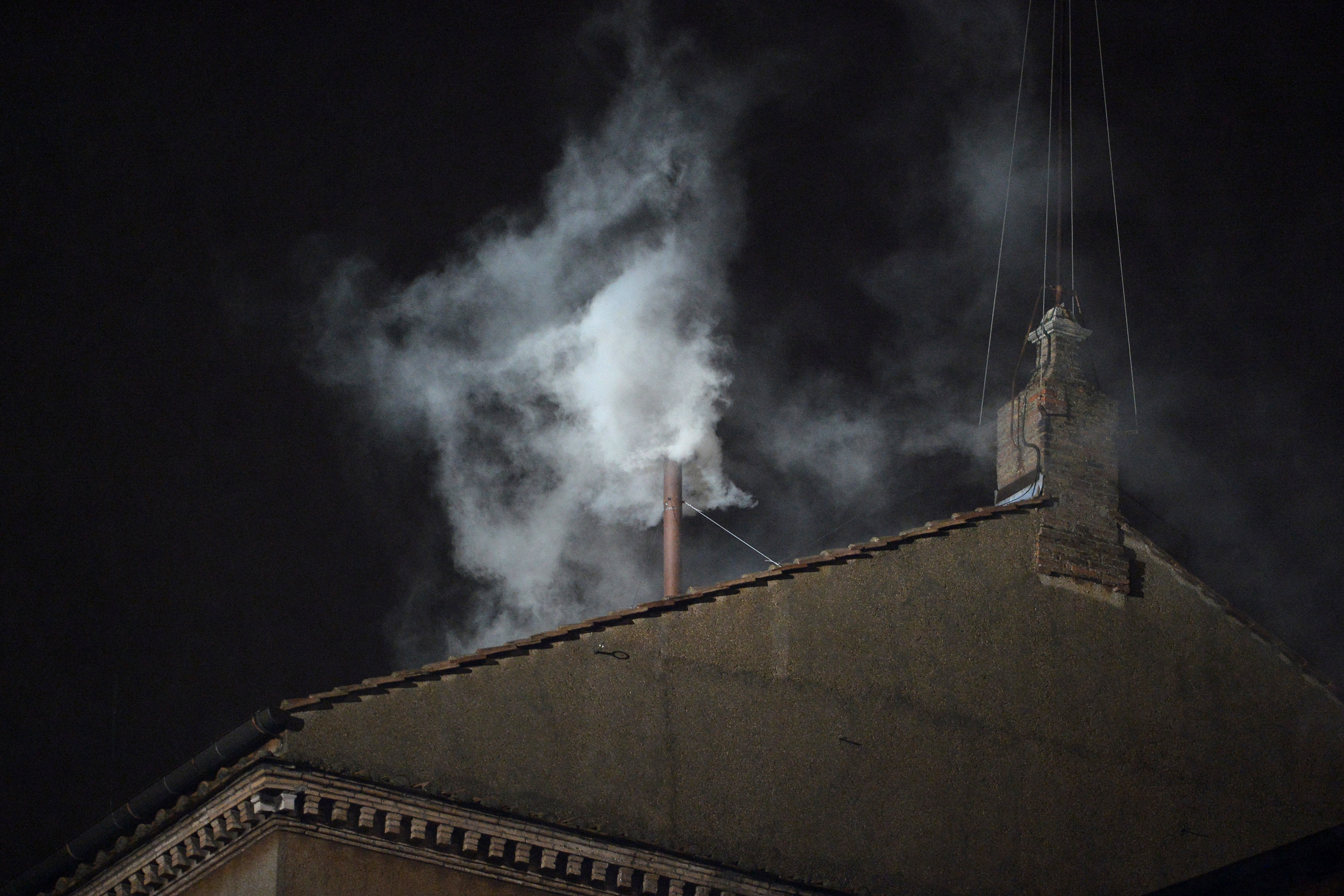 White smoke rises from the chimney on the roof of the Sistine Chapel meaning that cardinals elected a new pope on the second day of their secret conclave on March 13, 2013 at the Vatican. (credit: ALBERTO PIZZOLI/AFP/Getty Images)