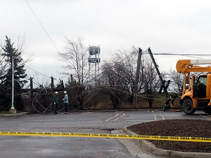 Utility poles are snapped in half near I-275 and 7 Mile Road. (credit: Mike Campbell/WWJ)