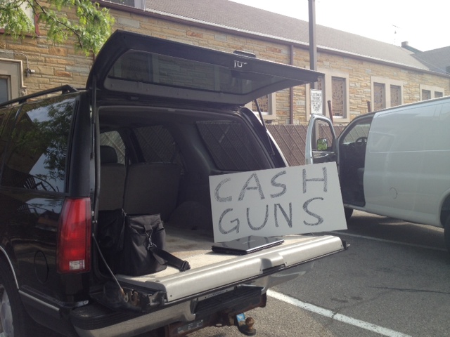 An alternative cash for guns program set up outside the church. 