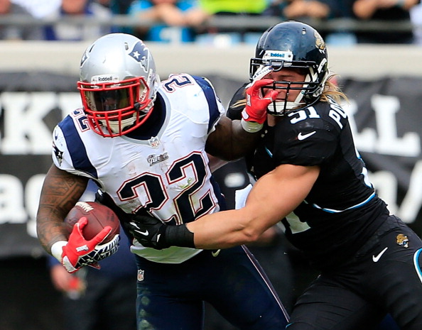 JACKSONVILLE, FL - DECEMBER 23:  Stevan Ridley #22 of the New England Patriots is tackled by  Paul Posluszny #51 of the Jacksonville Jaguars during the game at EverBank Field on December 23, 2012 in Jacksonville, Florida.  (Photo by Sam Greenwood/Getty Images)
