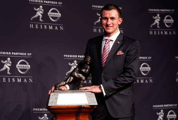 NEW YORK, NY - DECEMBER 08:  Quarterback Johnny Manziel of the Texas A&M University Aggies poses with the Heisman Memorial Trophy after being named the 78th Heisman Memorial Trophy Award winner at a press conference after at the Marriott Marquis on December 8, 2012 in New York City.  (Photo by Mike Stobe/Getty Images)