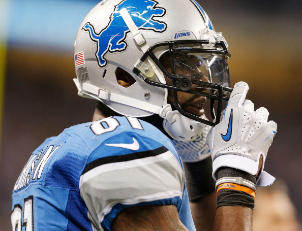 DETROIT, MI - DECEMBER 30:  Calvin Johnson #81 of the Detroit Lions straps up his helmet on the sideline while playing the Chicago Bears at Ford Field on December 30, 2012 in Detroit, Michigan. Chicago won the game 26-24. 