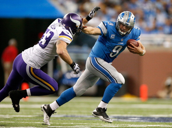 DETROIT, MI - SEPTEMBER 08: Matthew Stafford #9 of the Detroit Lions tries to outrun the tackle of Jared Allen #69 of the Minnesota Vikings during the fourth quarter at Ford Field on September 8, 2013 in Detroit, Michigan. Detroit won the game 34-24. 