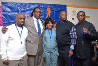 L)Travis Williams,  Andre Johnson of the  DRP,  Jennifer Jones, Marcus Kelly and Michael Berry all received keys to a new apartment in Highland Park. (Credit/Joseph Howse) 