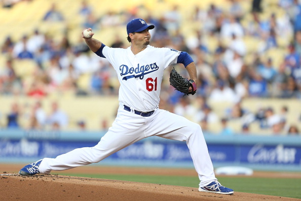 LOS ANGELES, CA - JUNE 26:  Josh Beckett #61 of the Los Angeles Dodgers pitches in the first inning against the St. Louis Cardinals at Dodger Stadium on June 26, 2014 in Los Angeles, California.  (Photo by Joe Scarnici/Getty Images)