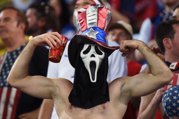 An US fan cheers before a Group G football match between Ghana and US  (credit: EMMANUEL DUNAND/AFP/Getty Images)