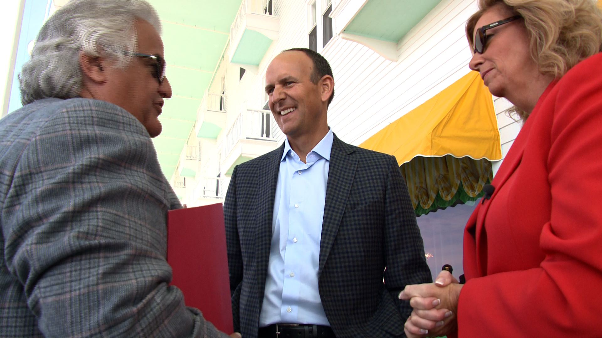 Amway President Doug DeVos (in the middle)  and Linden Nelson, founder, Michigan Motion Picture Studio in Pontiac, talk with Carol Cain about conditions in the state. (credit: Paul Pytlowany/CBS 62)