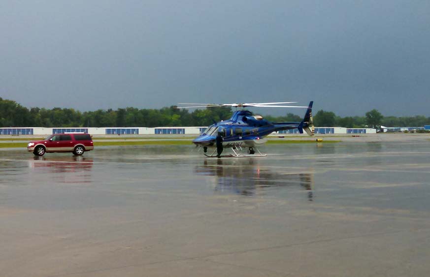 Gov. Rick Snyder lands in Waterford after surveying flooding damage from a helicopter. (credit: Russ McNamara/WWJ)