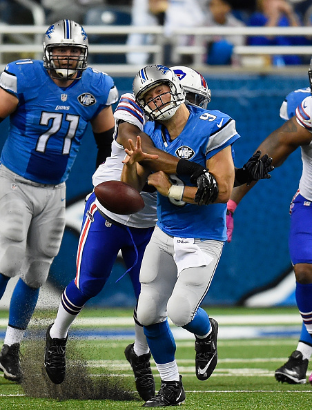 DETROIT, MI - OCTOBER 05: Matthew Stafford #9 of the Detroit Lions is sacked by Jerry Hughes #55 of the Buffalo Bills in the second quarter at Ford Field on October 05, 2014 in Detroit, Michigan. the Buffalo Bills win 17-14. (Photo by Joe Sargent/Getty Images)