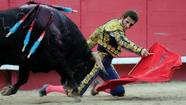 Spanish matador Juan Jose Padilla performs against a Domingo Hernandez bull during an Easter bullfight on April 6, 2012 in Arles, southern France. Spanish matador Juan Jose Padilla, blinded in one eye by a horrific goring less than six months ago, returned to the ring with a patch over his left eye and his face still partially paralysed. (Photo credit GERARD JULIEN/AFP/Getty Images)
