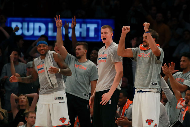 The New York Knicks bench reacts after a basket against the Boston Celtics during the second half of their preseason game at Madison Square Garden on October 15, 2016 in New York City. 