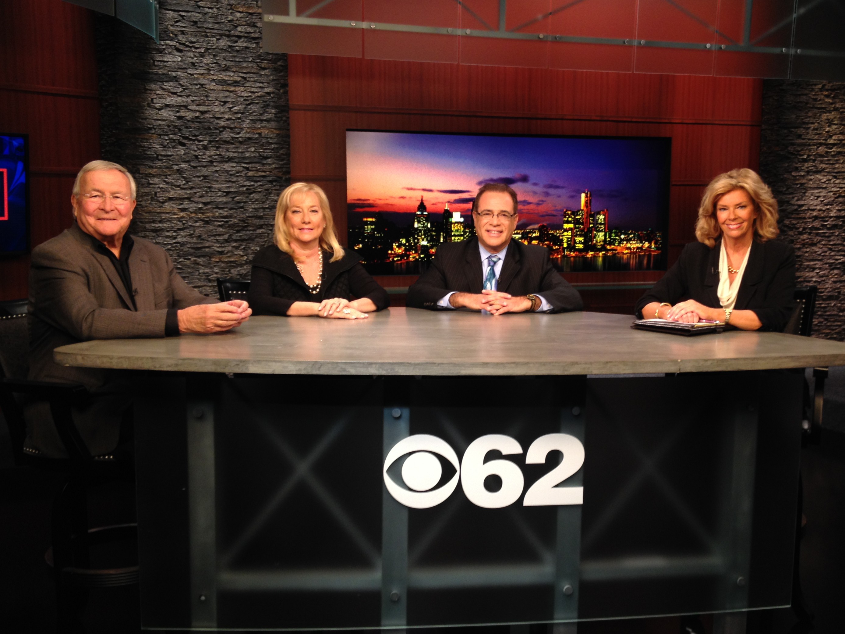 Oakland County Executive L. Brooks Patterson, Denise Ilitch and Wayne County Executive Robert Ficano with  Carol Cain on the "Michigan Matters" set. (credit: James C. Turner/CBS 62)