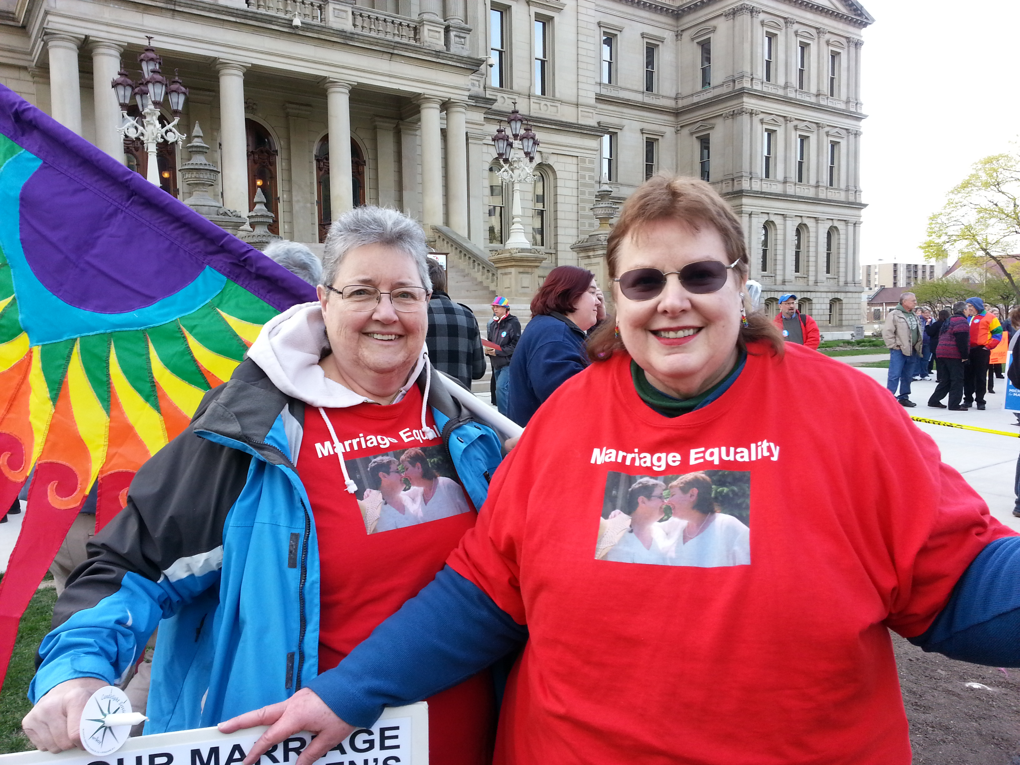 Jocelyn Walters (left) and Cindy Clarify of Southfield join a candlelight vigil on the steps of the state capitol in Lansing Monday night, in support of marriage equality (photo: Jon Hewett/WWJ)