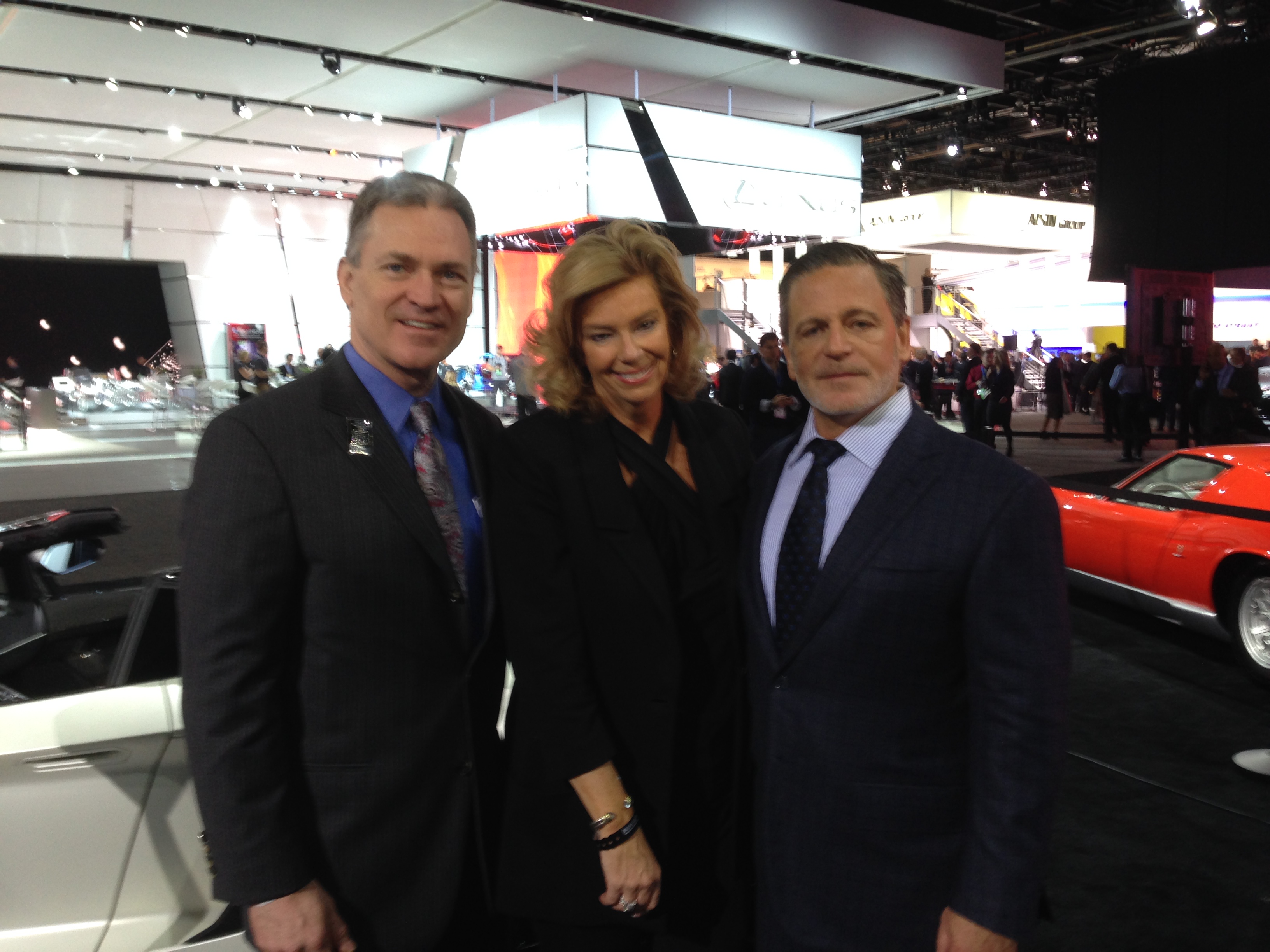 Rod Alberts, Carol Cain and Dan Gilbert at 2016 NAIAS at the Robb Report exhibit at Cobo Center.  That exhibit has Rolls-Royce and other luxury items on display. (credit: Derek Fawaz/CBS 62)