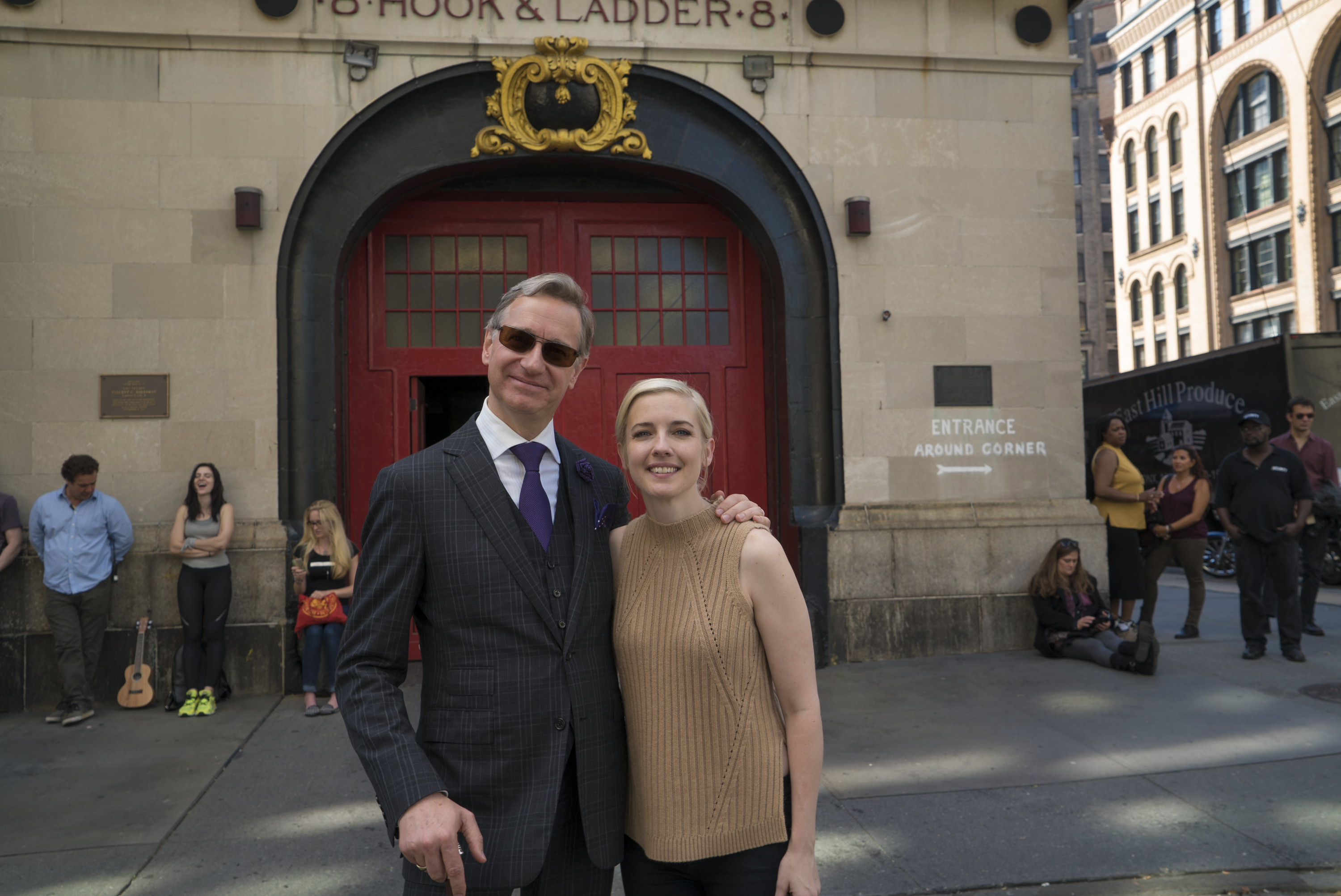 Director/writer Paul Feig poses with screenwriter Katie Dippold in front of the iconic fire station 8 Hook & Ladder 8 on the set of Columbia Pictures' GHOSTBUSTERS.