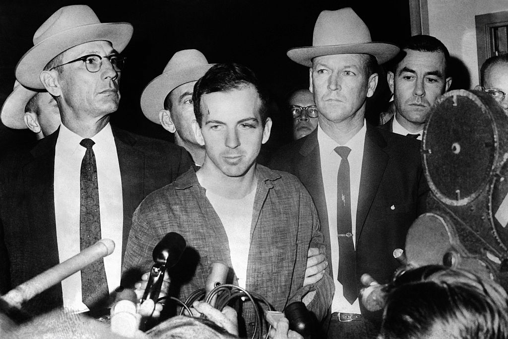 Picture dated 22 November 1963 of US President John F. Kennedy's murderer Lee Harvey Oswald during a press conference after his arrest in Dallas. Lee Harvey Oswald was killed by Jack Ruby on 24 November on the eve of Kennedy's burial. (Credit: STRINGER/AFP/Getty Images)